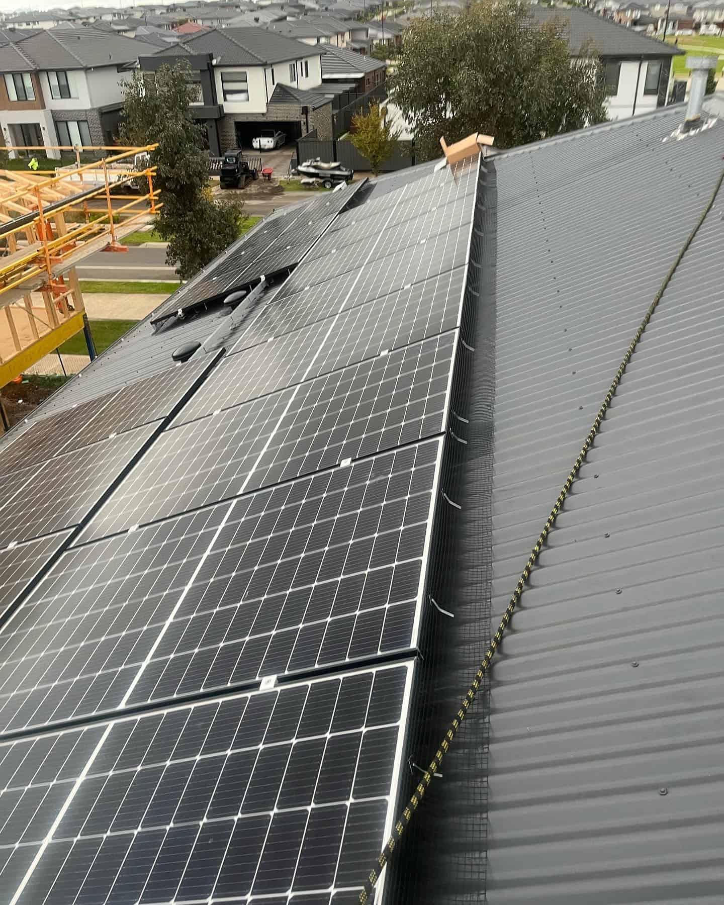 maximising energy efficiency by cleaning your solar panels, and bird proofing 32 solar panels on the one roof